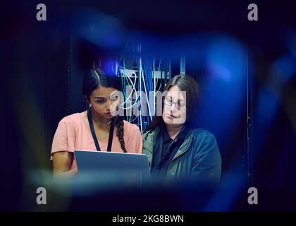 Female technicians working in server room Stock Photo