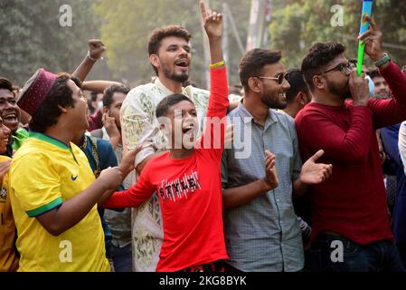 Dhaka, Bangladesh. 22nd Nov, 2022. Football fans watch the Qatar 2022 World Cup Group C football match between Argentina and Saudi Arabia on a big screen, in Dhaka, Bangladesh, on November 22, 2022. Credit: Mamunur Rashid/Alamy Live News Stock Photo