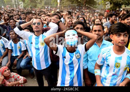 Dhaka, Bangladesh. 22nd Nov, 2022. Football fans watch the Qatar 2022 World Cup Group C football match between Argentina and Saudi Arabia on a big screen, in Dhaka, Bangladesh, on November 22, 2022. Credit: Mamunur Rashid/Alamy Live News Stock Photo