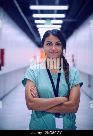 Portrait of smiling female technician in data center Stock Photo