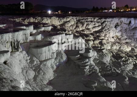 Pamukkale on the top with a view of the city of Denizli at night