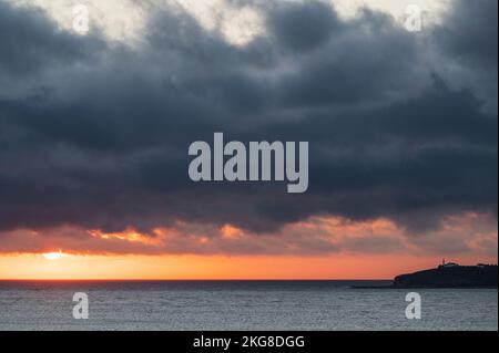 Canada, Labrador, Newfoundland, Rocky Harbor, Seascape with Lobster Cove Head Lighthouse at sunset Stock Photo