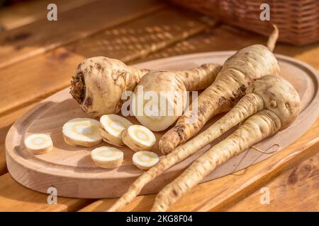 parsnip - sliced parsnip root on a cutting board Stock Photo