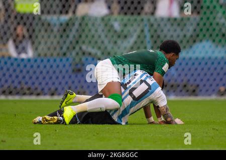 Al Daayen, Qatar. 22nd Nov, 2022. Lionel Messi of Argentina fouled by ALI  ALBULAYHI of Saudi Arabia during the FIFA World Cup Qatar 2022 Group C  match between Argentina and Saudi Arabia