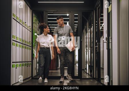 Joyful employees having a conversation on the go Stock Photo
