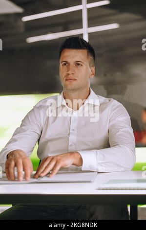 Visually impaired office worker reading documentation by touch Stock Photo
