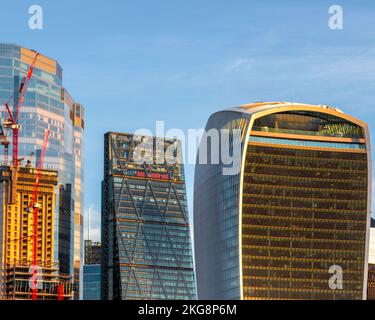 The walkie talkie building and the cheese grater/leadenhall building in the city of London with a golden morning glow. Stock Photo