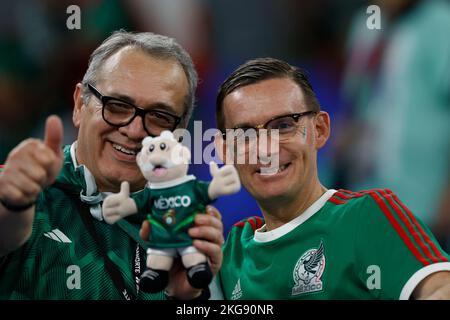 Doha, Qatar. 22nd Nov, 2022. Fans cheer prior to the Group C match between Mexico and Poland of the 2022 FIFA World Cup at Ras Abu Aboud (974) Stadium in Doha, Qatar, Nov. 22, 2022. Credit: Wang Lili/Xinhua/Alamy Live News Stock Photo