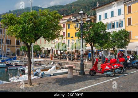 Gargnano Italy, view in summer of Piazza Feltrinelli in the scenic harbour area in the lakeside town of Gargnano, Lombardy, Italy Stock Photo