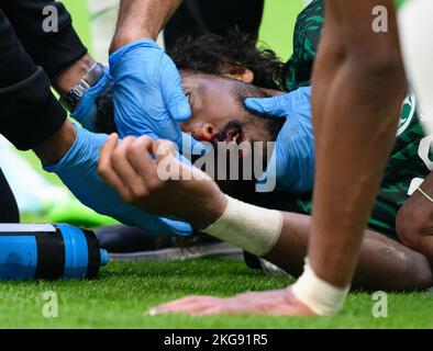 Lusail, Qatar. 22nd Nov, 2022. Soccer: World Cup, Argentina - Saudi Arabia, preliminary round, Group C, Matchday 1, Lusail Iconic Stadium. Yasser Alshahrani is being treated. Credit: Robert Michael/dpa/Alamy Live News Stock Photo