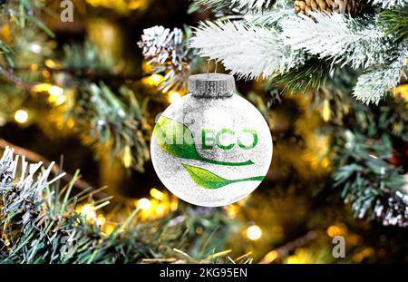 New Year's glass ball with the flag of Green environmental protection logo against a colorful Christmas background Stock Photo