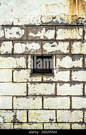 Peeling paint on block wall Stock Photo
