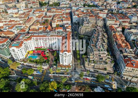 Aerial fly above La croisette Cannes on the French Riviera on the Mediterranean Sea. The location for the world Famous Cannes Film Festival Stock Photo