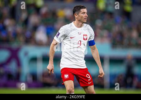 Doha, Qatar. 22nd Nov, 2022. Soccer: World Cup, Mexico - Poland,  Preliminary Round, Group C, Matchday 1, Stadium 974, Robert Lewandowski of  Poland walks across the field after exchanging team pennants. Credit: