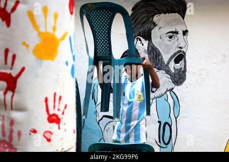 Dhaka, Dhaka, Bangladesh. 22nd Nov, 2022. A boy arranges chairs to watch Argentina vs Saudi Arabia football match in Dhaka's Swami Bagh. (Credit Image: © Syed Mahabubul Kader/ZUMA Press Wire) Stock Photo