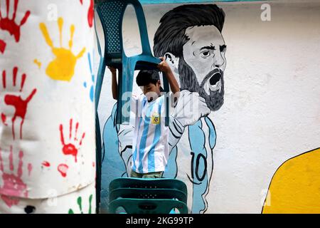 Dhaka, Dhaka, Bangladesh. 22nd Nov, 2022. A boy arranges chairs to watch Argentina vs Saudi Arabia football match in Dhaka's Swami Bagh. (Credit Image: © Syed Mahabubul Kader/ZUMA Press Wire) Stock Photo