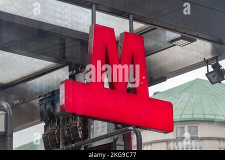 Copenhagen, Denmark - July 26, 2022: Red sign of Copenhagen metro. Logo of 24-7 service rapid transit system in Copenhagen. Stock Photo