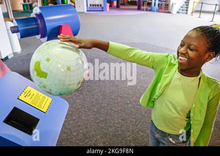 Portsmouth Virginia,High Street Children's Museum,exhibit display displays science hands on Black girl, Stock Photo