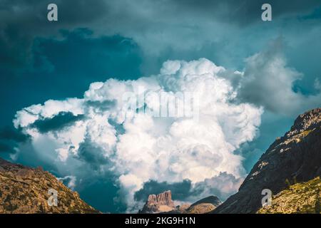 Description: Huge thunderclouds pile up over the  museum of the great war in the evening. Falzarego pass, Dolomites, South Tirol, Italy, Europe. Stock Photo