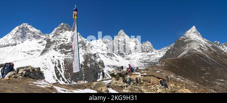 Hikers near village Machermo 4470m . Khumbu region of Nepal. It lies in the Dudh Kosi River valley just north of Dole and south of Gokyo. Stock Photo