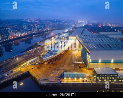 Glasgow, Scotland, UK. 22 November 2022. Aerial view of HMS Glasgow at BAE Systems Govan shipyard  just before being transferred by barge to nearby Scotstoun shipyard on the River Clyde. The ship is a Type 26 anti-submarine frigate.  Iain Masterton/Alamy Live News Stock Photo