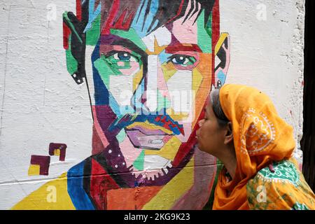 Dhaka, Dhaka, Bangladesh. 22nd Nov, 2022. A Brazil football fan kisses a picture of her favorite player Neymar in Dhaka. (Credit Image: © Syed Mahabubul Kader/ZUMA Press Wire) Stock Photo