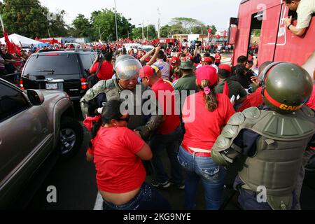 Maracaibo-Venezuela-23-03-2013- Members of the Venezuelan Armed Forces prevent supportes of president Nicolas MAduro from coming to greet him. Stock Photo