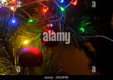 Lights on Christmas tree. Christmas and New Year decorations on Christmas tree. Closeup of Christmas tree decorations. Lights on Christmas tree Stock Photo