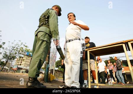 Maracaibo-Venezuela-14-04-2013- The military checks and attendees at polling station during presidential election in Venezuela. Stock Photo