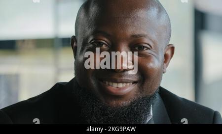 Friendly millennial african american bearded plus size man lawyer businessman ceo manager entrepreneur office clerk optimistic joyful male with happy Stock Photo