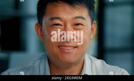 Happy smiling korean japanese confident 40s man successful businessman worker specialist agent businessperson banker leadership representative joyful Stock Photo