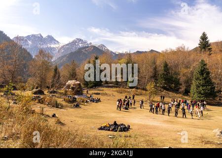 Group of tourists in plateau, valley in Tien-Shan mountains, South Kazakhstan, Central Asia Stock Photo