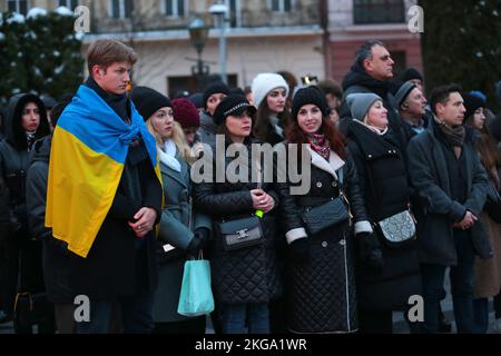 LVIV, UKRAINE - NOVEMBER 21, 2022 - Participants of the Maidan Reminiscences art event on the Dignity and Freedom Day and the 9th anniversary since the beginning of the Revolution of Dignity on the square at the Taras Shevchenko monument, Lviv, western Ukraine. Stock Photo