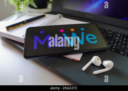 In this photo illustration a MeWe app seen displayed on a smartphone with  the MeWe logo in the background. (Photo by Thiago Prudencio / SOPA  Images/Sipa USA Stock Photo - Alamy