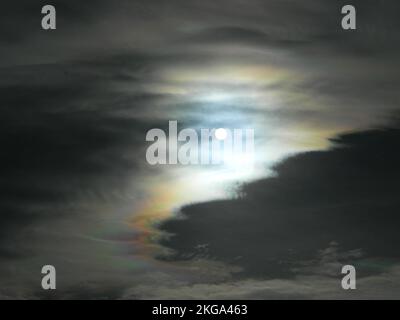 A cloudy night against the bright full moon Stock Photo