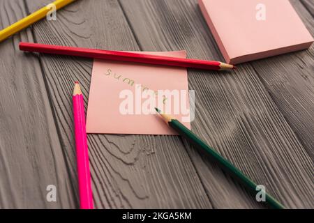 artist multicolored pencils sketch paper card inscription summer. Yellow red blue pencils. Summer background template mockup space blank colorful Stock Photo