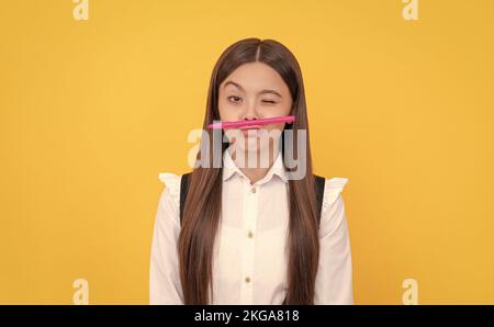 Knowledge day. Winking girl hold pen as mustache. School education. Knowledge day. Learning fun Stock Photo