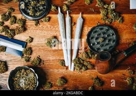 Marijuana Joint, Pipe and Grinder on White Background Horizontal