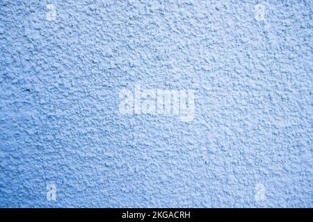 Background vignetted image of a wall decorated with blue-tinted stucco or gotelé. Copy space Stock Photo