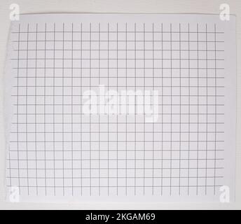 Checkered paper with torn top edge, blank blank sheet, texture and background, copy of space, template. Stock Photo