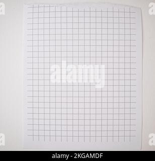 Checkered paper with torn top edge, blank blank sheet, texture and background, copy of space, template. Stock Photo
