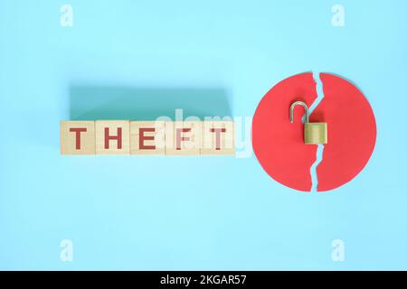 Data breach and information theft concept. Creative composition with word on wooden blocks and opened padlock. Stock Photo