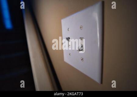 Light switch downstairs one on one off Stock Photo