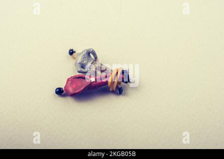 Tiny figurine of men model wrapped in rope Stock Photo