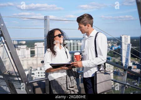 business colleagues discussing working documents in the business center. Stock Photo