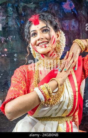 A beautiful woman playing sindur khela on the occasion of vijya dashmi. portrait of Indian woman. Stock Photo