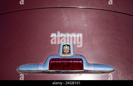 NISSWA, MN – 30 JUL 2022: Tail light and logo on the trunk of an old restored Dodge automobile or car. Selective focus with shallow depth of field. Stock Photo
