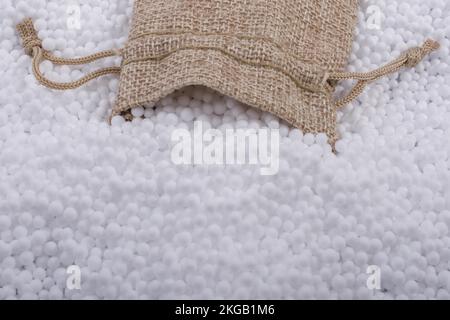 Little sack in White polystyrene foam balls as background Stock Photo ...