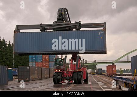 Container terminal, Kalmar spreader handles containers delivered by ...