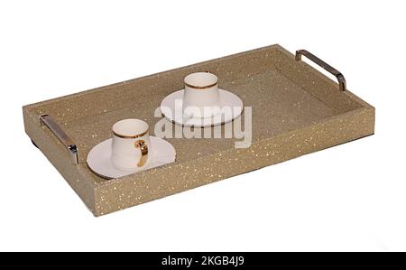 Sparling golden tray with gold ceramic coffee cups isolated on white background Stock Photo